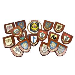Various European cities and states, wooden heraldic shields each with hand painted raised shield including Baden Wurttemberg, Kunzelsau, City of London, Kingston upon hull etc, seventeen in total. . 
