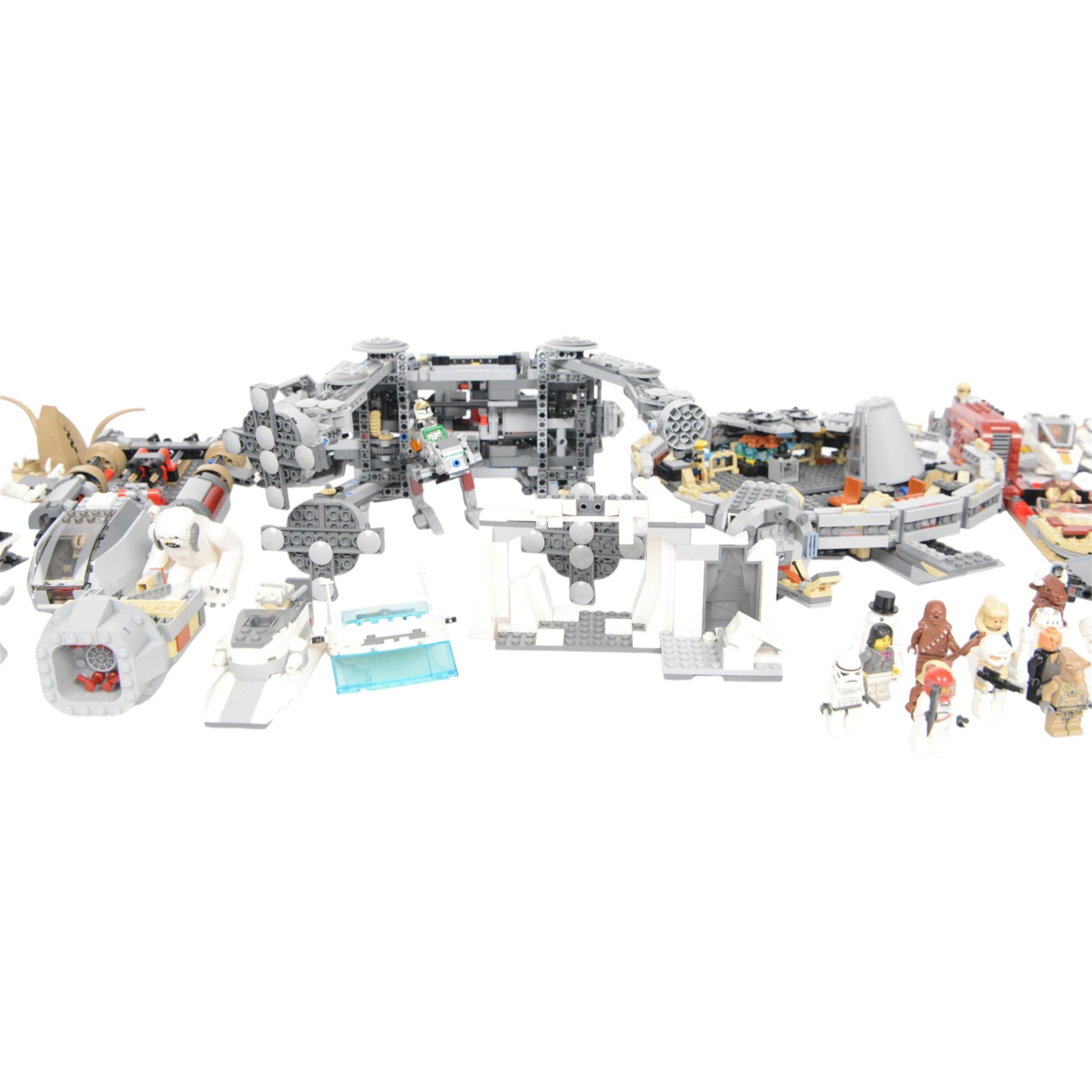 Collection of partially built Lego Star Wars models, including Motorized Walking AT-AT no. 10178, Hyena Droid Bomber no.8016, Emperor Palpatines Shuttle no. 8096, Jabbas Palace no. 4480 and Millennium Falcon no. 4504, etc together with a quantity of Lego Star Wars minifigures, loose parts and instruction booklets for Lego Star Wars sets