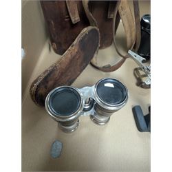Three pairs of binoculars including Wrayvu 8x30 and Busch Hellux, together with a tabletop magnifying glass