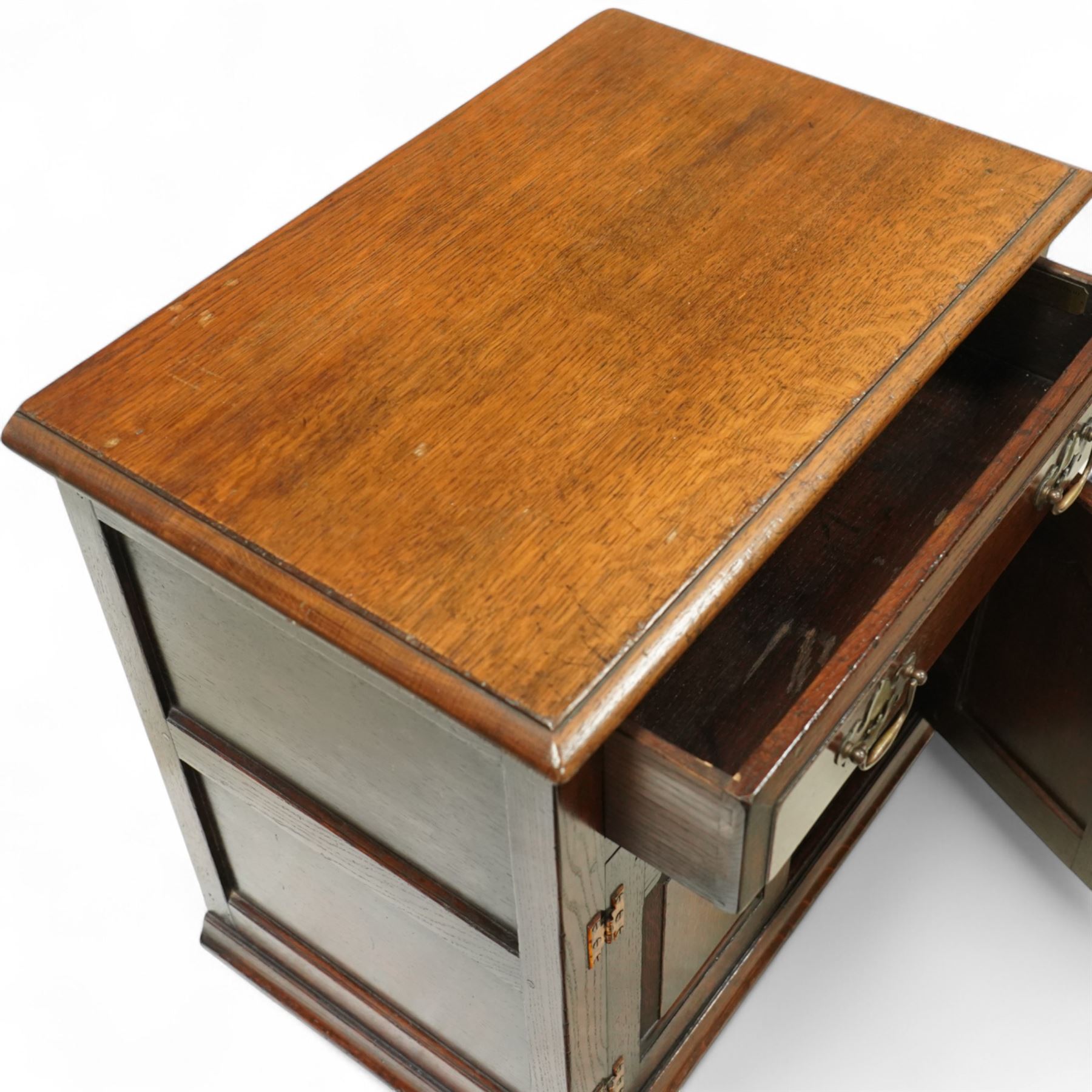 Titchmarsh & Goodwin - small oak side cupboard, moulded rectangular top over single drawer and double cupboard, stepped and pointed arched panelled doors, raised on stile feet 