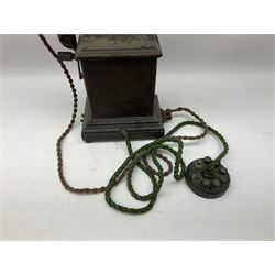 Early 20th century Danish desk telephone inscribed The Ericsson Bell Telephone Co. Glasgow to one side and Aktieselskabet Electrisk Bureau Kristiansand to the other, ebonised wooden top with handset on brass cradle. black japanned tin centre section bearing Hull Corporation Telephones Department crest, side cranking handle and ebonised wooden base H30cm  