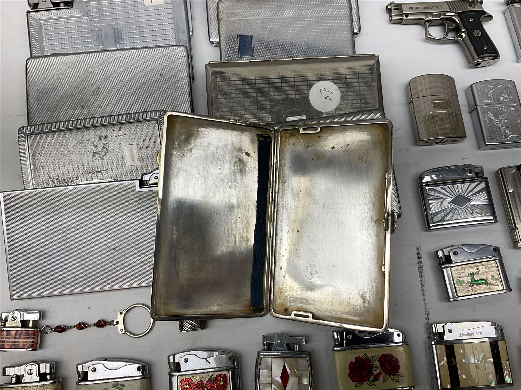 Collection of lighters to include examples by Ronson, Kingsway and Penguin, mother of pearl and engine turned examples, together with quantity of cigarette cases