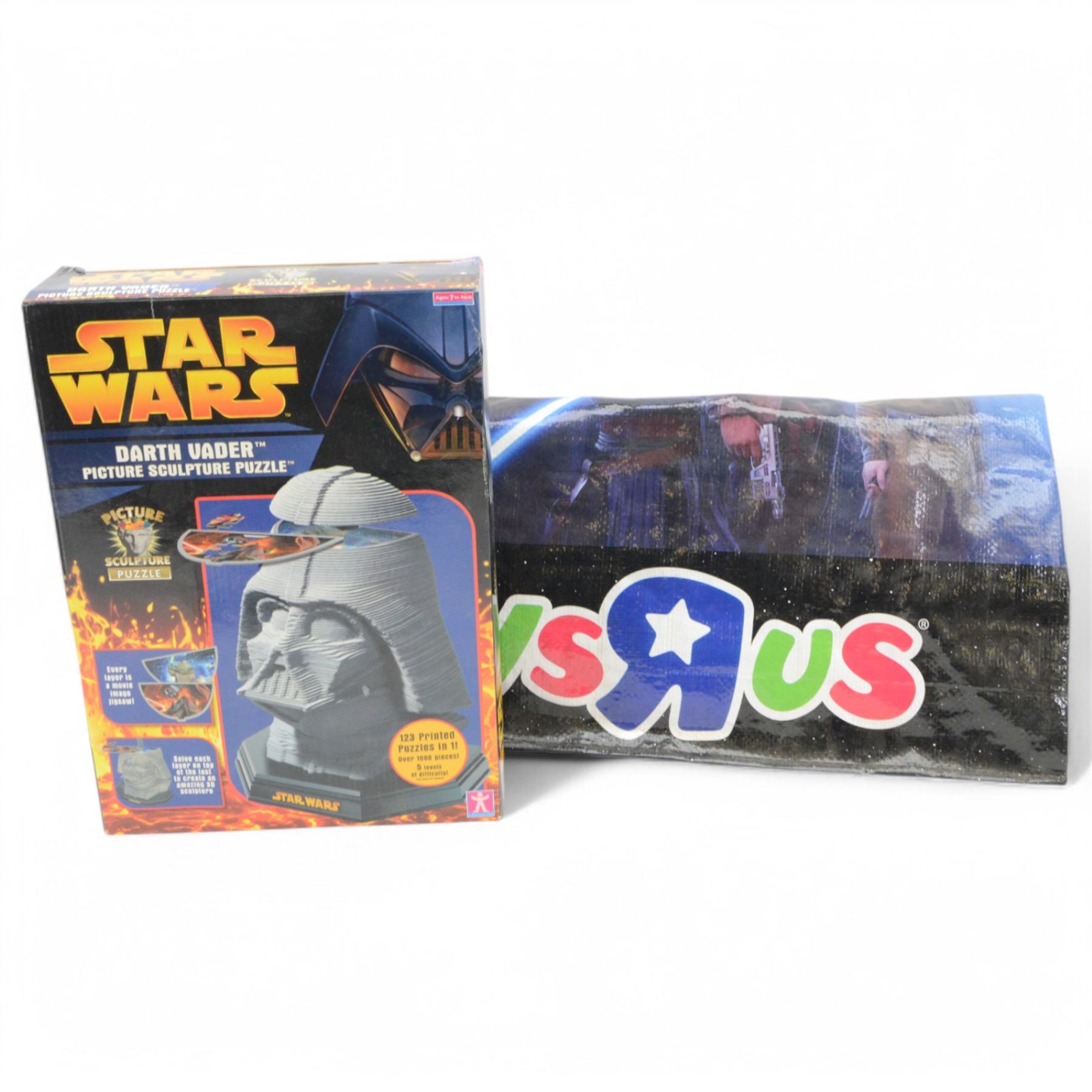 Star Wars puzzles and games, including four sealed MB Games 200piece jigsaw puzzles, two Darth Vader sculpture puzzles, limited edition sealed Ravensburger The Force Awakens Labyrinth game, two Special Edition Star Wars Trilogy Mousemats in original packaging, and a collection of Star Wars The Force Awakens ephemera including tins, flags, 3D glasses, etc