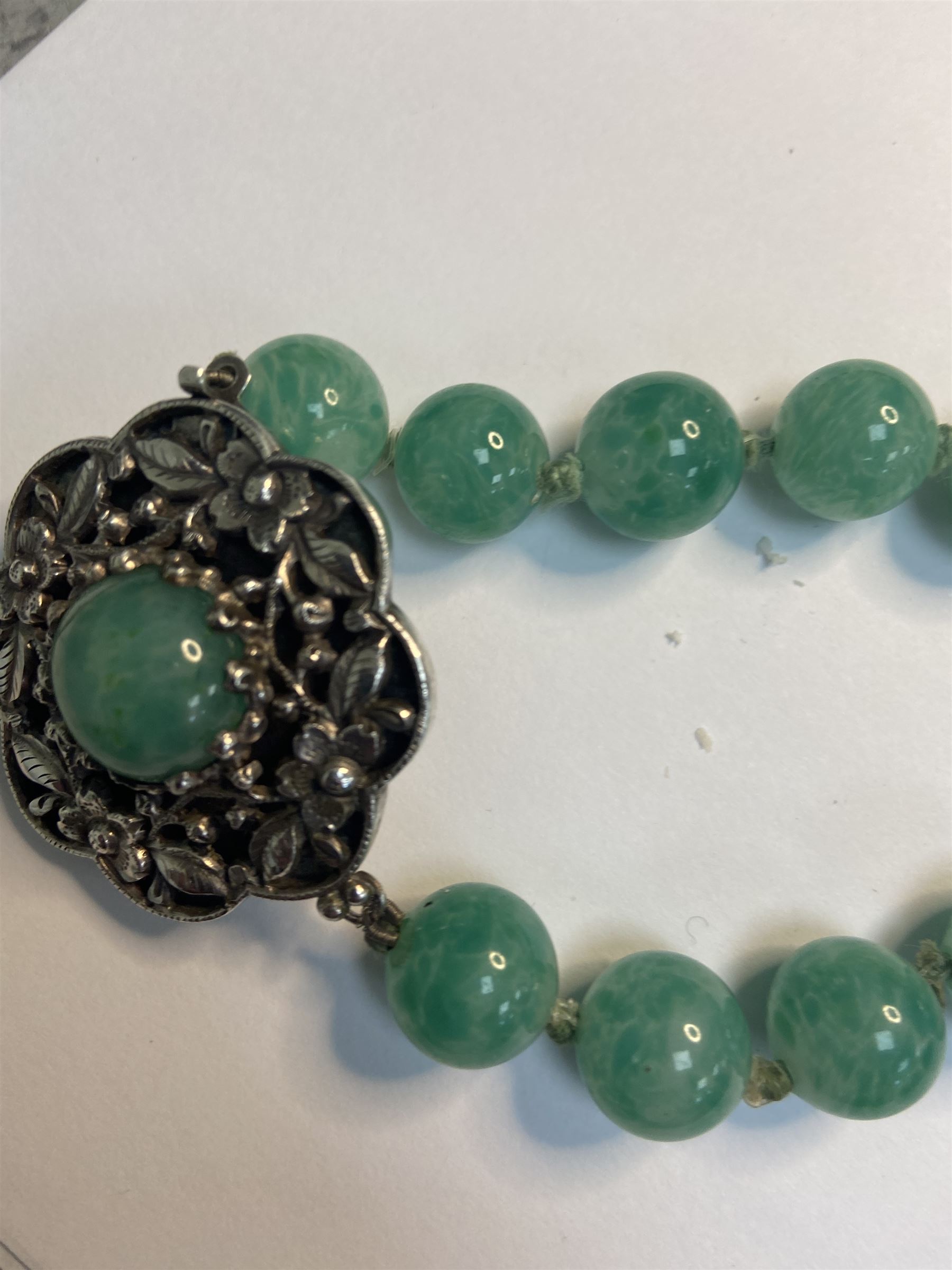 Chinese jade bead necklace with silver open work clasp with a cabochon greenstone/possibly jade bead necklace, signed Liu with Chinese character marks