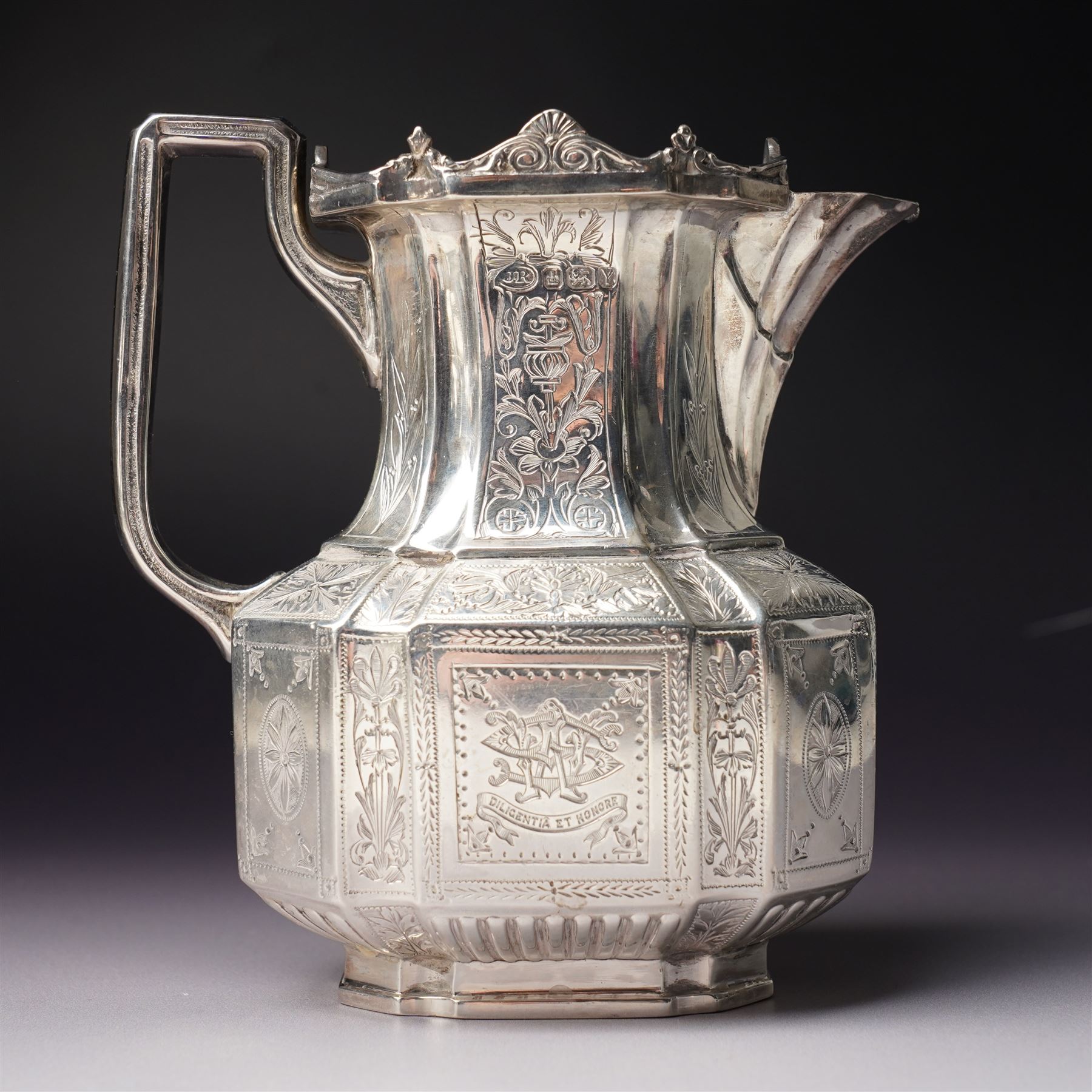 Victorian silver tea and coffee set engraved with classical urns, oval paterae and scrolling foliage, monogram and 'Diligentia et Honore' comprising teapot, tea kettle on spirit heater stand, coffee pot, two handled sugar bowl and cream jug Sheffield 1891 Maker John Round & Son Ltd