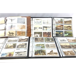 Six modern loose leaf albums containing over one thousand Edwardian and later postcards including real photographic and printed topographical, museum sets, comic, greeting, glamour, actresses, Bamforth song cards etc  