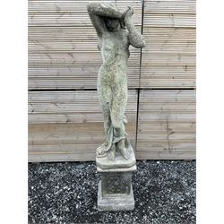 Cast stone garden figure of a woman with arms raised - THIS LOT IS TO BE COLLECTED BY APPOINTMENT FROM DUGGLEBY STORAGE, GREAT HILL, EASTFIELD, SCARBOROUGH, YO11 3TX