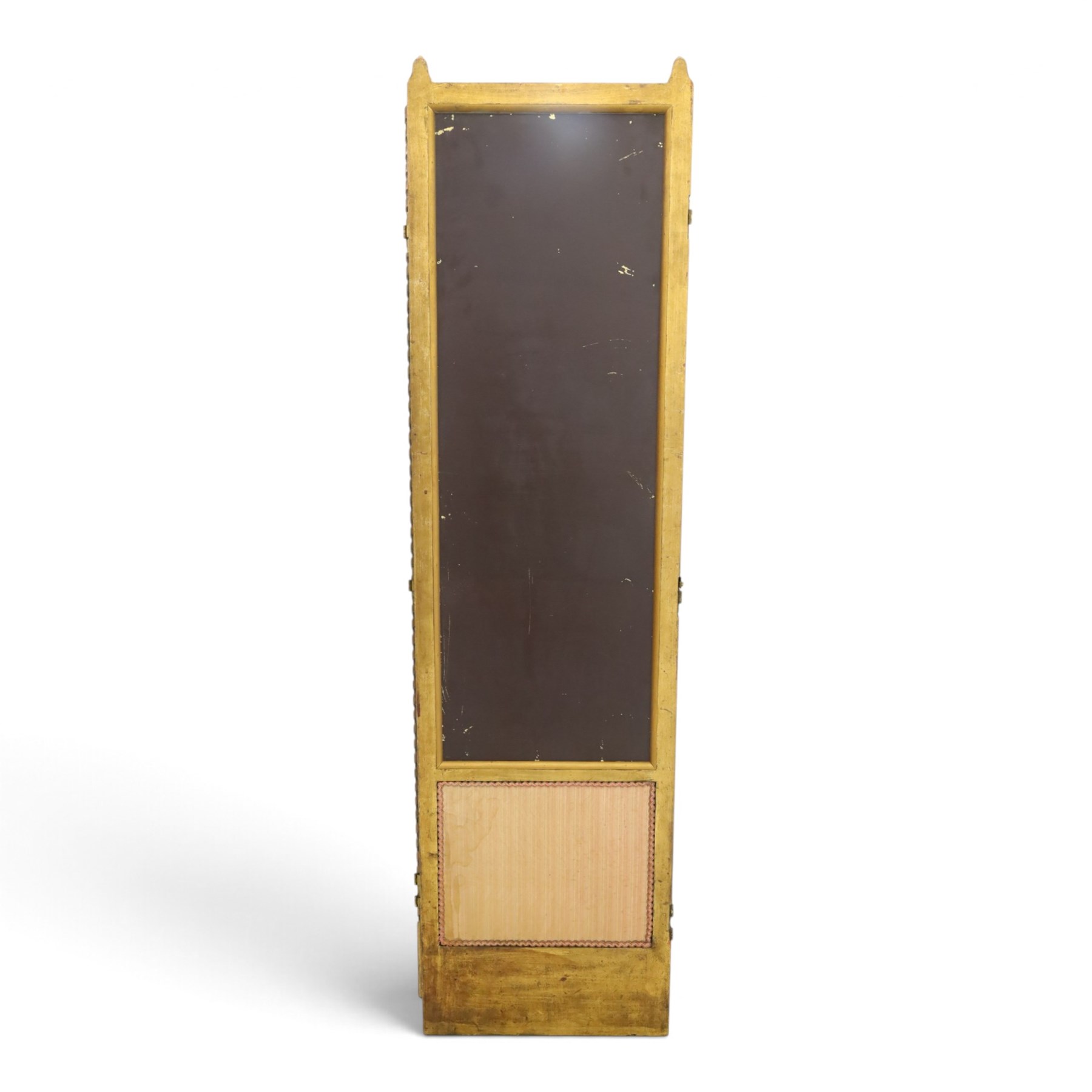 Early 20th century gilt and bevelled mirrored four panel folding screen, with two mirrors per side, flanked by beaded edges and scrolled finials, arcaded carved frieze