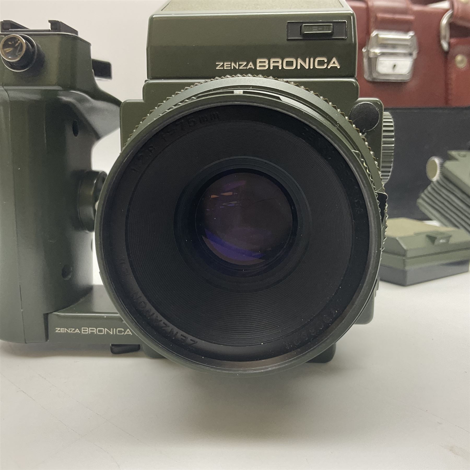 Zenza Bronica ETRS camera body, safari edition, serial no. 7100811, with 'Zenza Bronica Zenzanon EII 1:2.8 f=75mm' lens, serial no. 7908591, film magazine back, safari, serial no. 8100564, AE-ii metering head, safari, serial no. 617024, etc, all in leather case