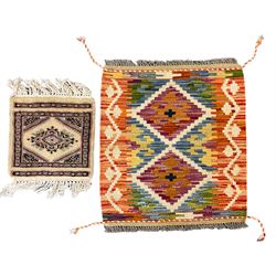 Chobi Kilim multi-colour mat (55cm x 50cm), and a square Mori Jaldar mat (30cm x 30cm)