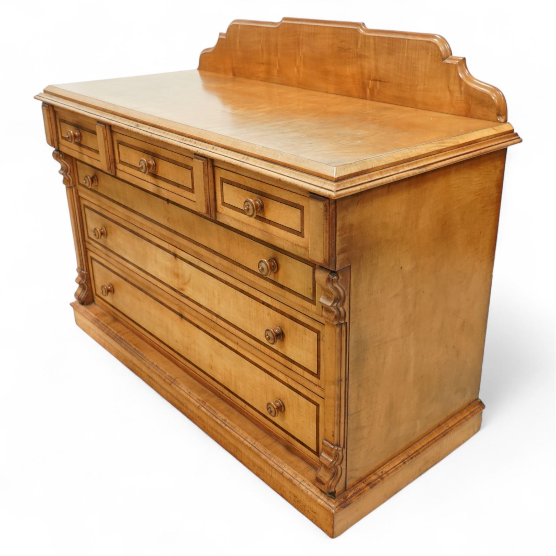 William Snowdon of Rochdale (fl.1876-1886) - Victorian sycamore chest of drawers, rectangular top with shaped gallery back above an arrangement of three short and three long drawers, each with moulded borders and turned wooden pulls, flanked by carved upright corbels, on a plinth base (99cm height including gallery)
