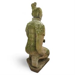 Two near life-size terracotta warrior figures, modelled in the style of the Qin dynasty soldiers, each kneeling with one arm raised, wearing detailed armour and tunics, one example partially damaged and lacking sections