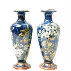 Pair of Doulton Lambeth vases, painted with white flowers, impressed marks to base and signed MA, for Mary Aitken, 1878, H28cm (2)