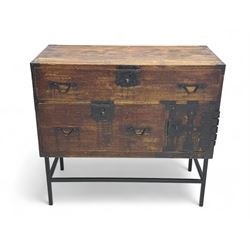 Late 19th century Japanese tansu chest, crafted with a cedar frame and cypress wood panels, original iron fittings throughout, comprising a single long drawer above smaller drawer and hinged cupboard door enclosing two smaller internal drawers and storage compartment, mounted on a bespoke black metal stand