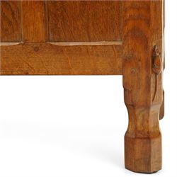 Mouseman - 1950s adzed oak blanket chest of unusual proportions, the rectangular hinged top with canted corners, over a sextuple panelled front, raised on turned octagonal feet, carved with mouse signature, by the workshop of Robert Thompson of Kilburn