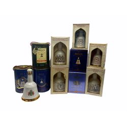 Eleven Bell's Old Scotch Whisky ceramic decanters including Christmas 1988, and Royal Decanters 'Pricess Beatrice 1988', 'Princess Eugenie 1990',  'Prince William of Wales 1982' 'Prince Harry of Wales 1984 etc, seven 75cl, 43%vol, four 50cl and 40% vol and two 70cl and 40% vol, all decanter seals intact