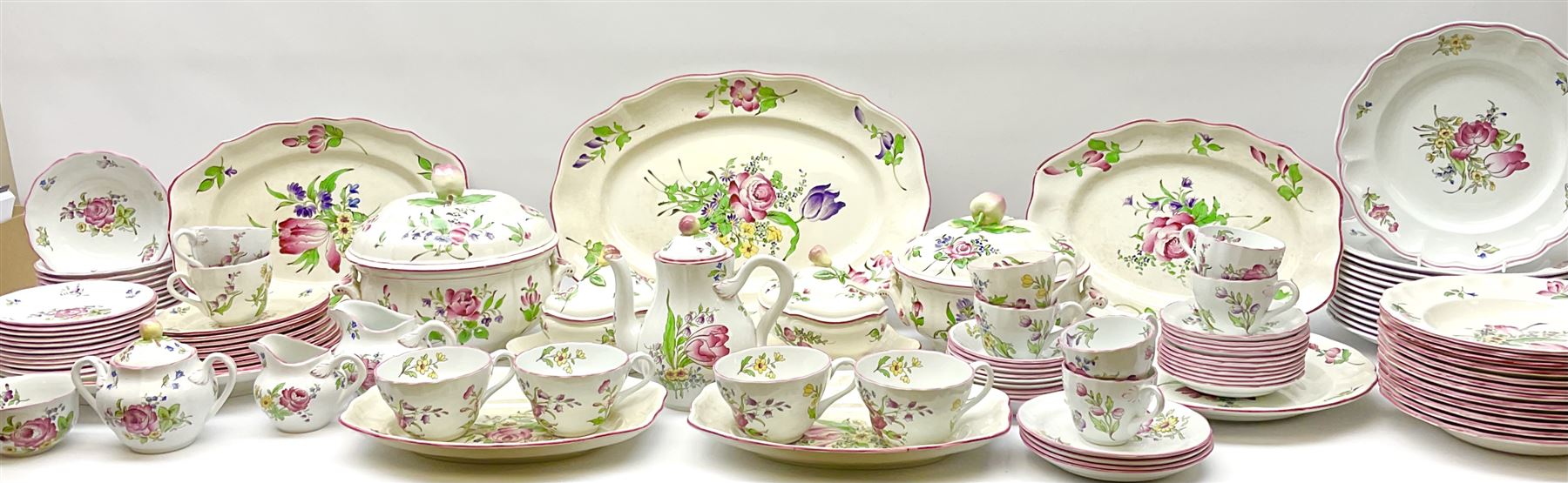 Matched Copeland Spode, Spode and French Luneville and Marlborough Sprays pattern dinner and tea wares, comprising two tureen and covers and apple finials, two sauce tureen and covers with pear finials and fixed stands, six graduated platters including two pairs, large plate, thirteen dinner plates, twelve bowls, ten smaller bowls, eight side plates, eleven smaller side plates, teapot, twin handled sucrier and cover with apple finial, open sucrier, cream jug, smaller cream jug, four breakfast cups, eight tea cups, four large saucers, eleven smaller saucers, and nine further smaller saucers. 