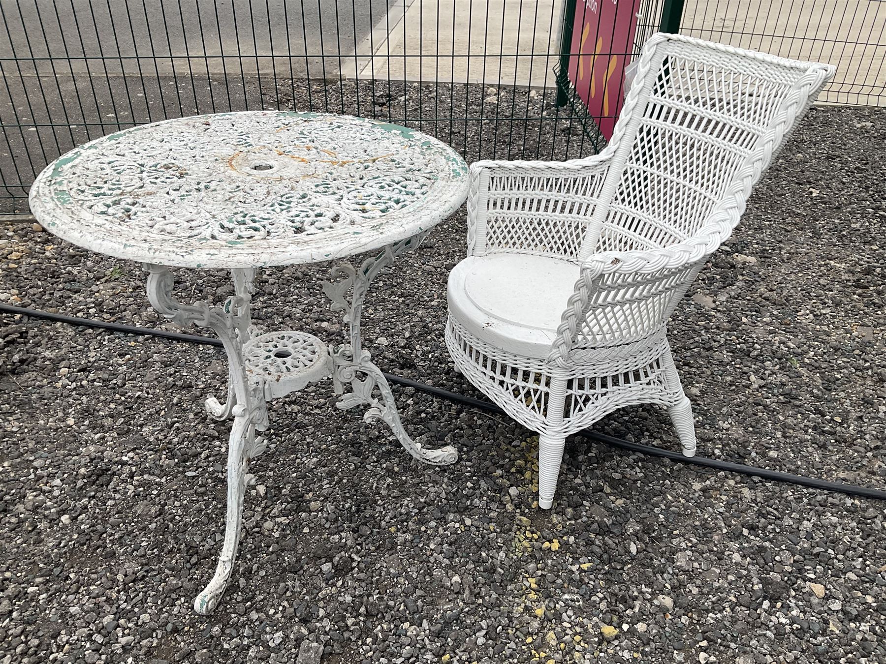 White painted, cast aluminium bistro table, and wicker painted chair
