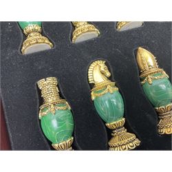 Franklin Mint House of Faberge 'The Imperial Jewelled Chess Set', to include set of chess pieces with malachite finish and a set with carnelian finish and a hardwood chess board