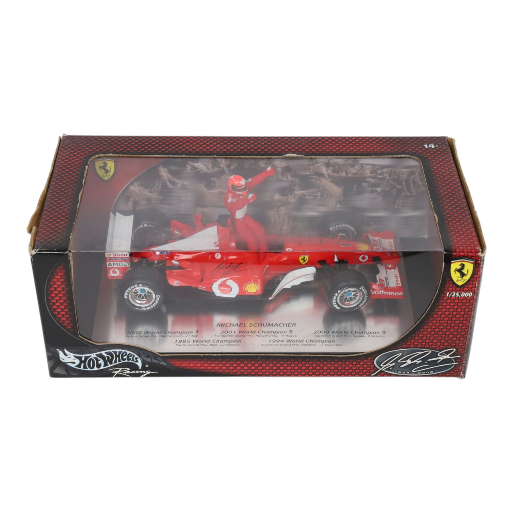 Signed Michael Schumacher Hot Wheels Ferrari 1:18 scale model, 2002 five-times World Champion edition depicting Schumacher sitting on the side of his car with arms raised, with his signature in black marker to wing of car, boxed