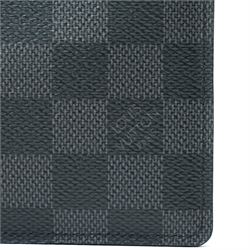 Louis Vuitton Damier Graphite canvas passport holder, the black and grey checkerboard exterior opening to a crossgrain leather interior with card slots and slip pockets, stamped Louis Vuitton Paris and made in Spain, together with original Louis Vuitton box and dust cloth