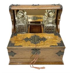 Victorian oak tantalus, mirrored high-back with recess for housing the decanters, behind a hinged box, with cribbage board to the concealed drawer below, marked Barman, London, H33cm, L37cm