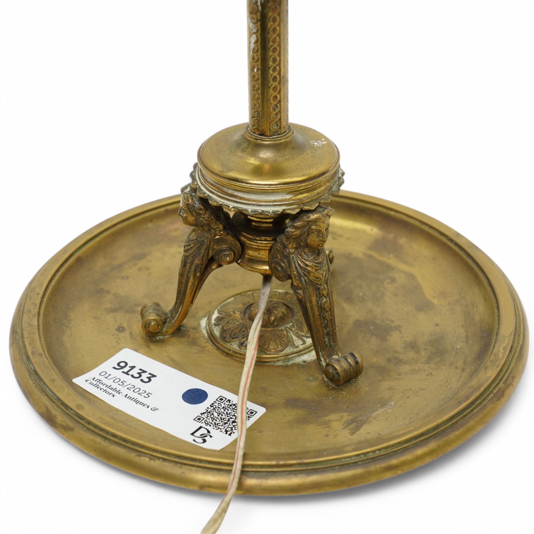 Brass table lamp, of antique design with classical figures on a circular base, H29cm