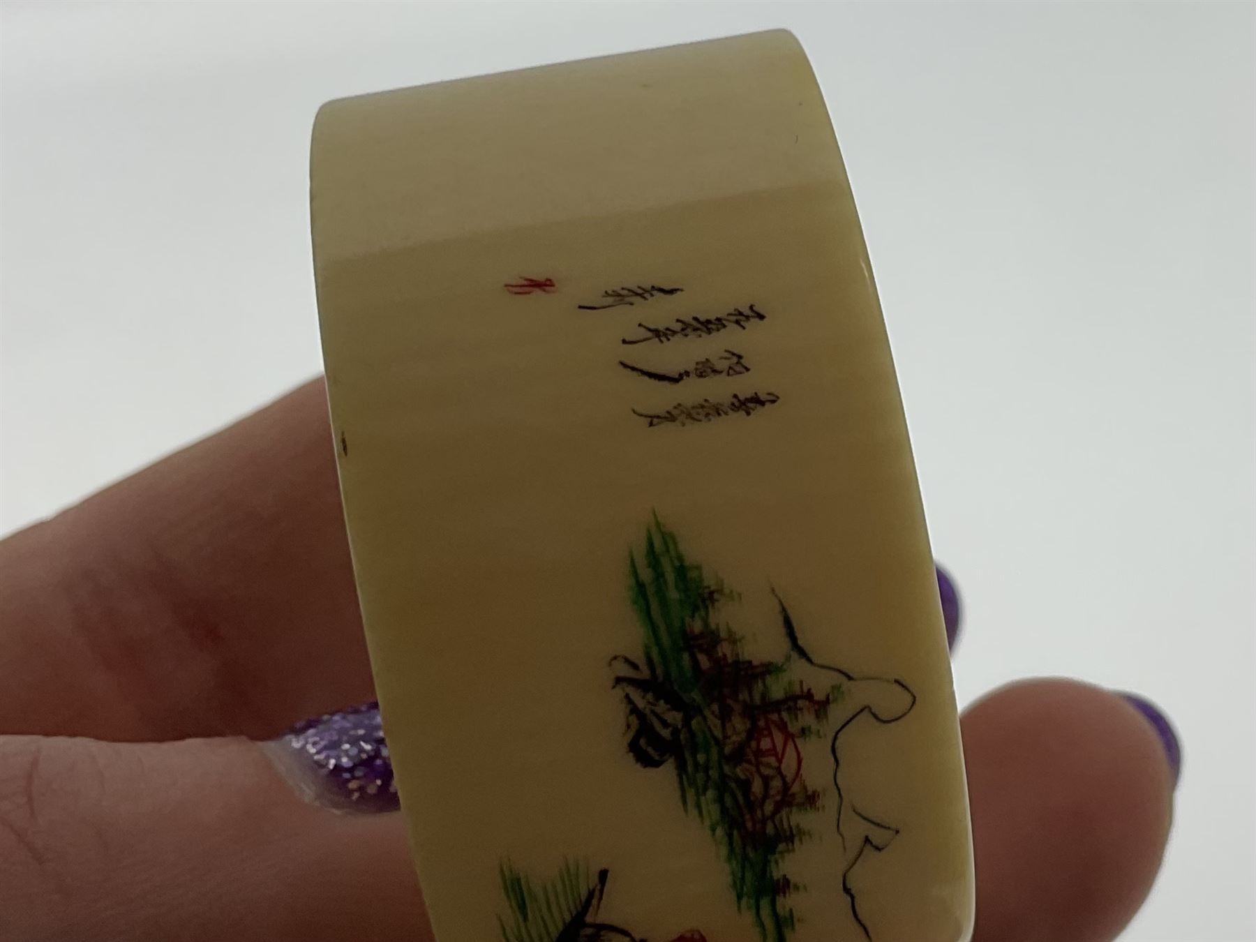 Set of six early 20th century Chinese ivory napkin rings decorated with figural scenes and calligraphy