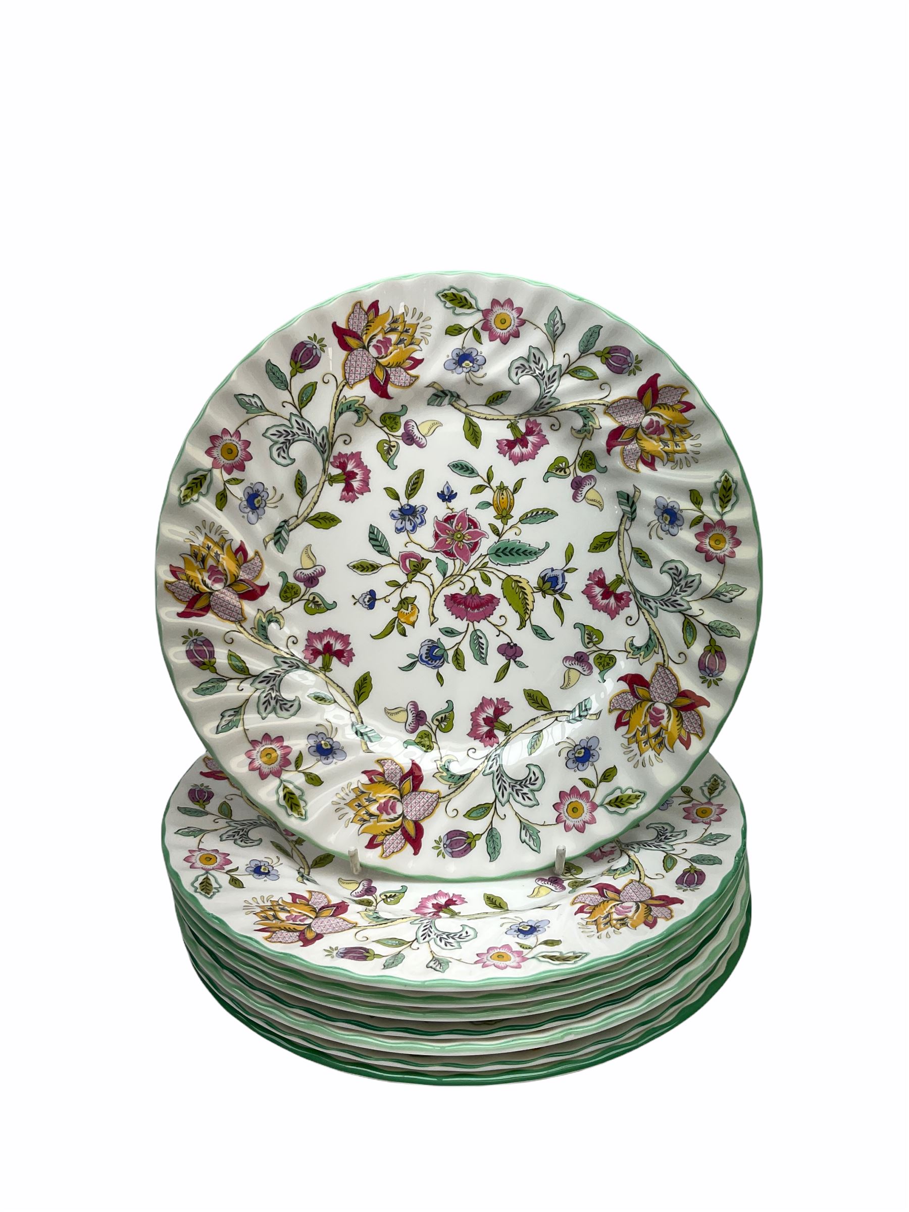 Minton Haddon Hall pattern tea and dinner wares, including basket dish, two covered tureens, six dinner plates, eight dessert plates, twelve tea plates, six soup bowls, six cereal bowls, teapot, coffee pot, milk jug, covered sucrier twelve tea cups and saucers, six mugs, footed bon bon dish, pair of candlestick holders, cake knife and slice etc (81)