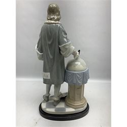 Lladro figure, Columbus, modelled as Christopher Columbus stood by a globe, limited edition 896/1200, no 1432, sculpted by Salvador Furio, with original box, year issued 1982, year retired 1988, H42cm