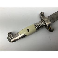 German Reichsarbeitdienst RAD Leader's Hewer dagger, the 26cm single edged scimitar shaped blade with narrow fuller, etched Arbeit adelt; by E.D. Wusthof, Solingen; the aluminium hilt with spade and wheat ear langet; two piece white plastic grip and eagle head pommel; pebbled steel scabbard engraved with ears of wheat and strapwork with double leather hangers L40cm overall