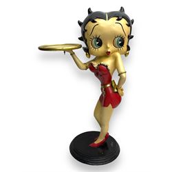 Contemporary Betty Boop waitress figure, modelled standing with one hand holding a circular tray, dressed in a red dress with gold accents, on a black circular base