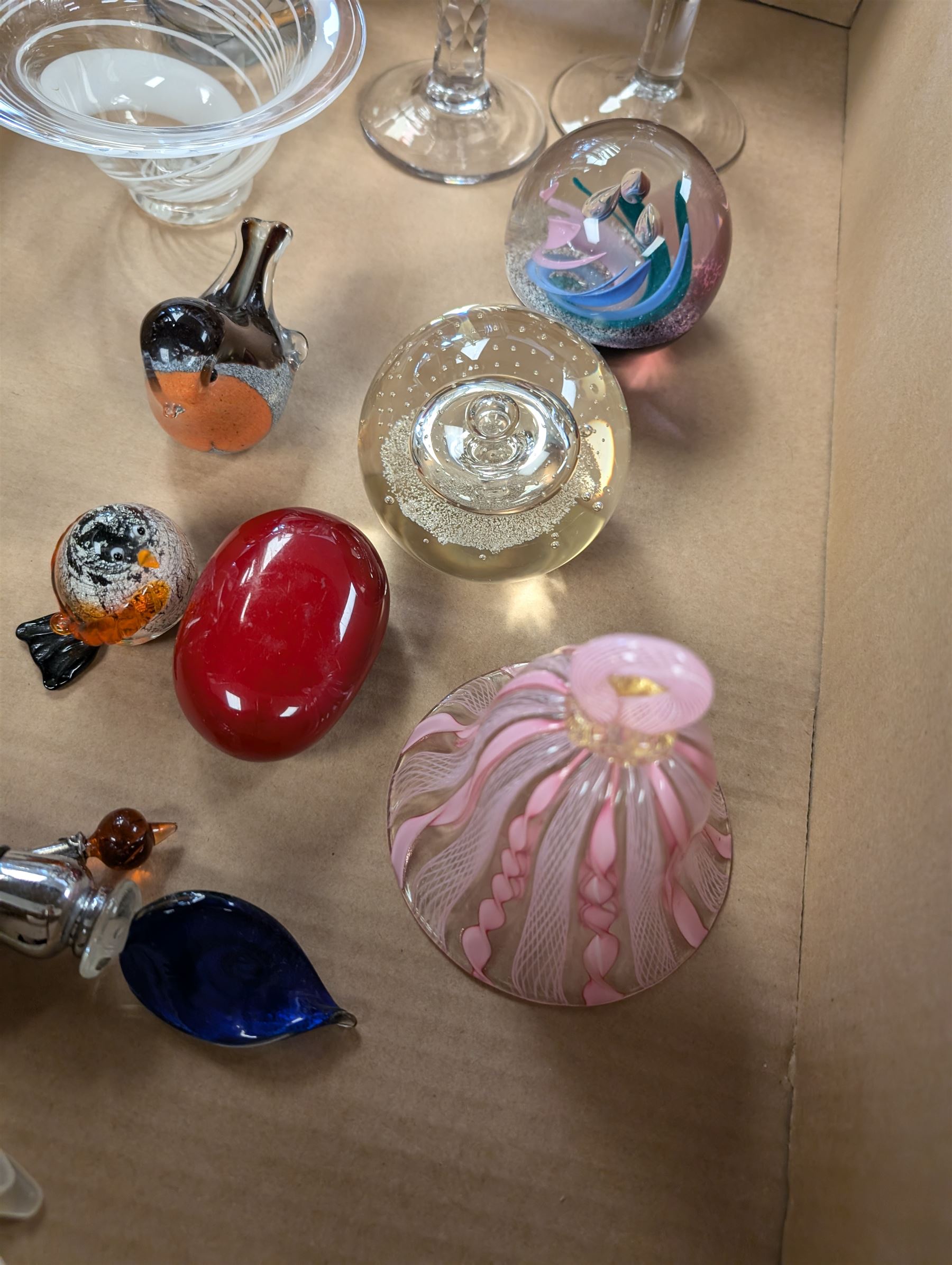 Collection of glassware, including two Caithness paperweights, Langham robin paperweight, Murano bell, etc