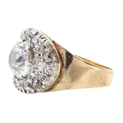 George III gold and silver old cut diamond cluster ring, the principal diamond of approx 0.75 carat, with pave set old cut diamond surround
