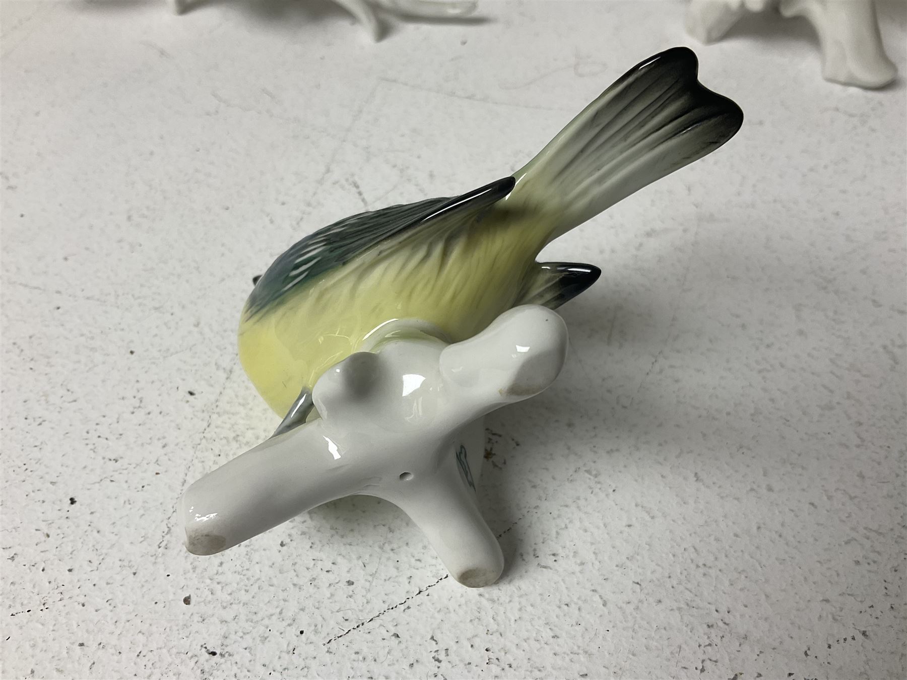 Seven Karl Ens bird figures, including barn owl, eagle owl, blue tit, budgerigar etc, all with mark beneath, tallest H17cm 