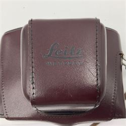 Leitz Leicaflex SL2 camera body, serial no.1387046, with 'Summicron-R 1:2/50 Leitz Wetzlar' lens, serial no. 2273397, within a leather Leitz lens hood 