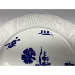 Three 19th century plates, comprising two circular examples and one oblong, each with osier moulded sides, the centres decorated in underglaze blue with Gillyflower type pattern, circular examples D25cm oblong example W27cm