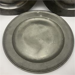 Group of seven 19th century pewter chargers, each of circular form with dished centre, two examples with touch marks verso, each approximately D39cm