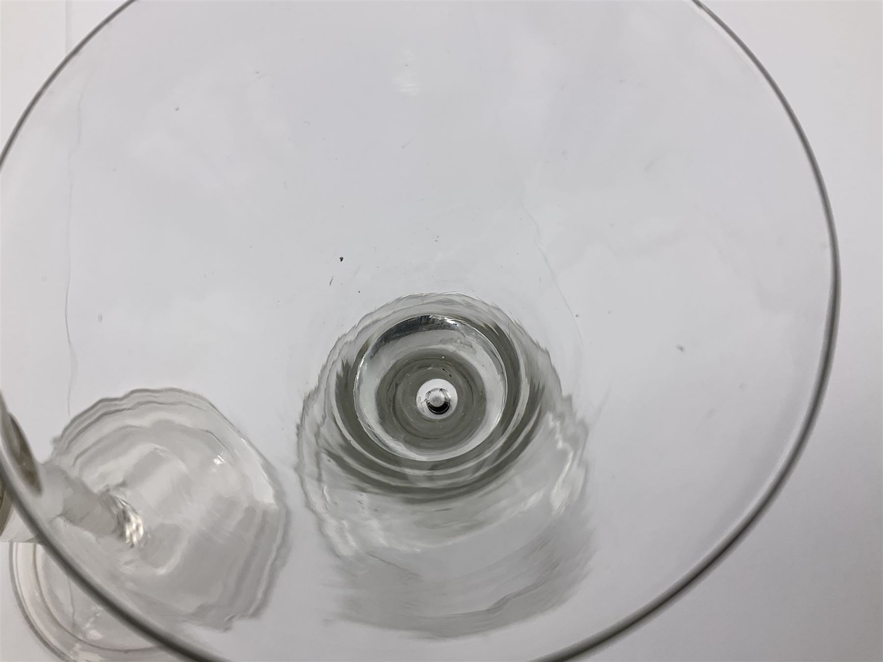 18th century wine glass, the trumpet shaped bowl upon tear drop stem and conical folded foot, H15.5cm, together with an 18th century cordial glass, the round funnel bowl on plain knopped stem and folded conical foot