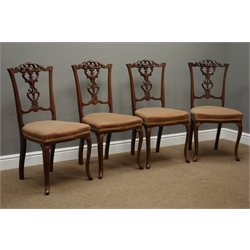 Set four Edwardian walnut dining chairs, pierced and scroll carved cresting rail and splat, upholstered serpentine seat, cabriole legs  