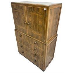 Early 20th century Art Deco walnut cocktail tallboy chest, fitted with double cupboard enclosing two shelves over two short and three long drawers, each with shell shaped handes