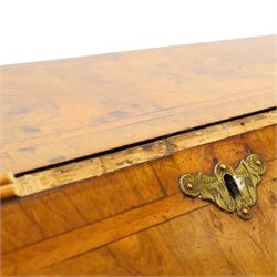 18th century figured walnut bureau, the sloped fall-front enclosing fitted interior with sliding base, pigeon-holes and correspondence drawers with shaped facias, over two short and two long feather-banded drawers with pressed brass handle plates, on bracket feet