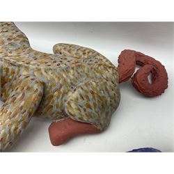 Helen Skelton (British 1933 – 2023): Two carved wooden abstract sculptures, one modelled as a dog, the other modelled as a bear, both with painted stippled decoration, largest H20cm. Born into an RAF family in 1933 in Kent and travelled the world extensively during her childhood. After settling in Bridlington, Helen immersed herself in painting, textiles, and wood sculpture, often inspired by nature's beauty. Her talent was showcased in a one-woman show at Sewerby Hall and recognised with the sculpture prize at Ferens Art Gallery in 2000. Sadly, Helen’s daughter passed away from cancer in 2005. This loss inspired Helen to donate her sculptures to Marie Curie upon her passing in 2023.