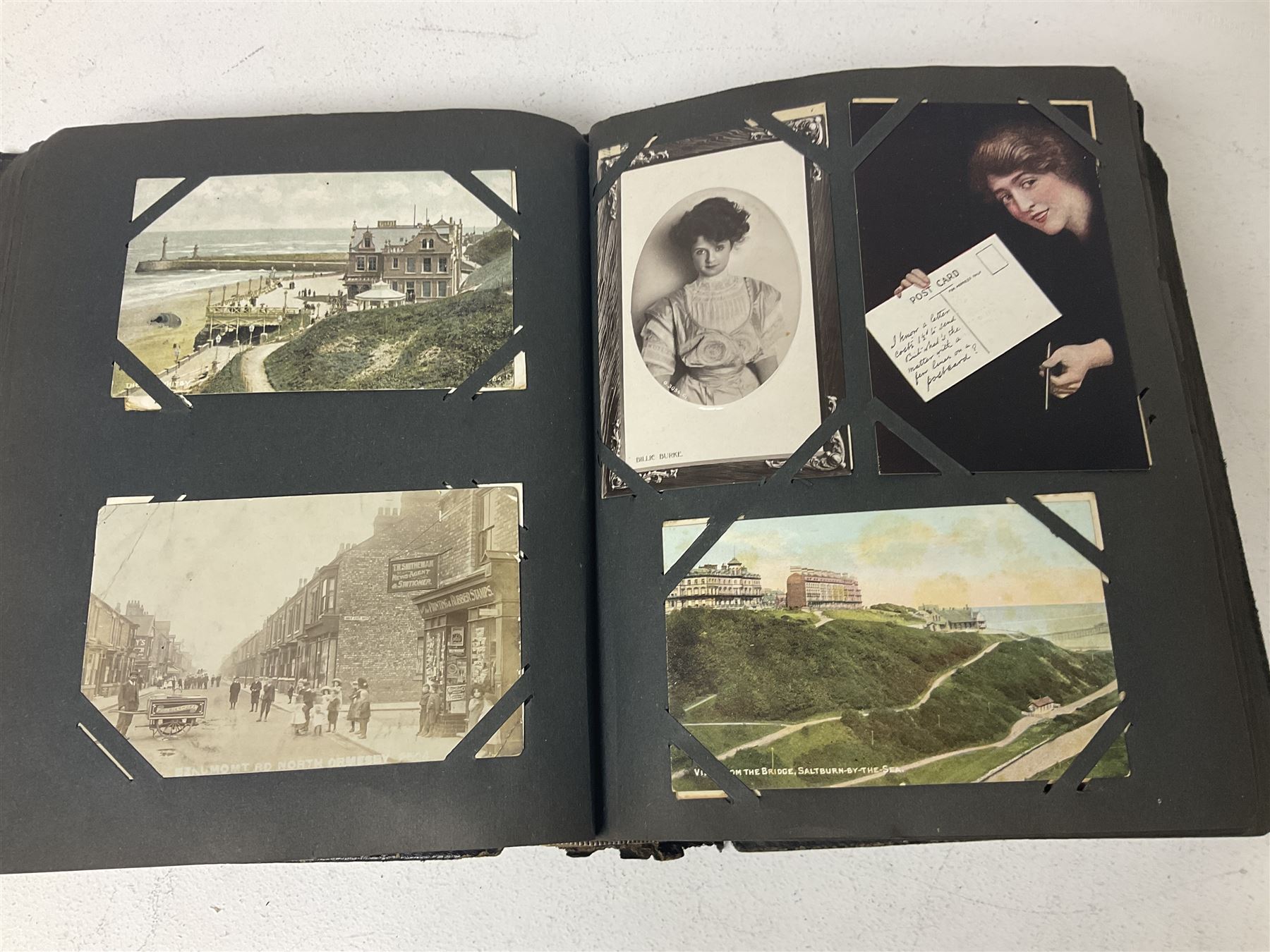 Postcard album with Victorian and later postcards, including silk cards, landscapes of the UK, portraits, Christmas cards etc  