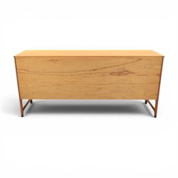 Nathan - 'Squares' mid 20th century teak sideboard, fitted with three drawers with brass ring handles, above a central fall front cabinet, flanked by two cupboard doors, raised on square tapering supports