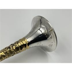 Pair of modern silver candlesticks by Stuart Devlin, the tapering parcel gilt stems with signature textured detailing, each supporting a fluted candle holder and upon a spreading circular foot, hallmarked Stuart Devlin, London 1973, H25cm