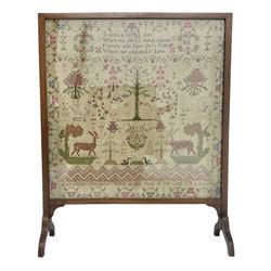 Victorian sampler, worked by Ann Jane Dawsons, age 14, dated 1838, depicting a verse above biblical motifs, later mounted into a mahogany fire screen