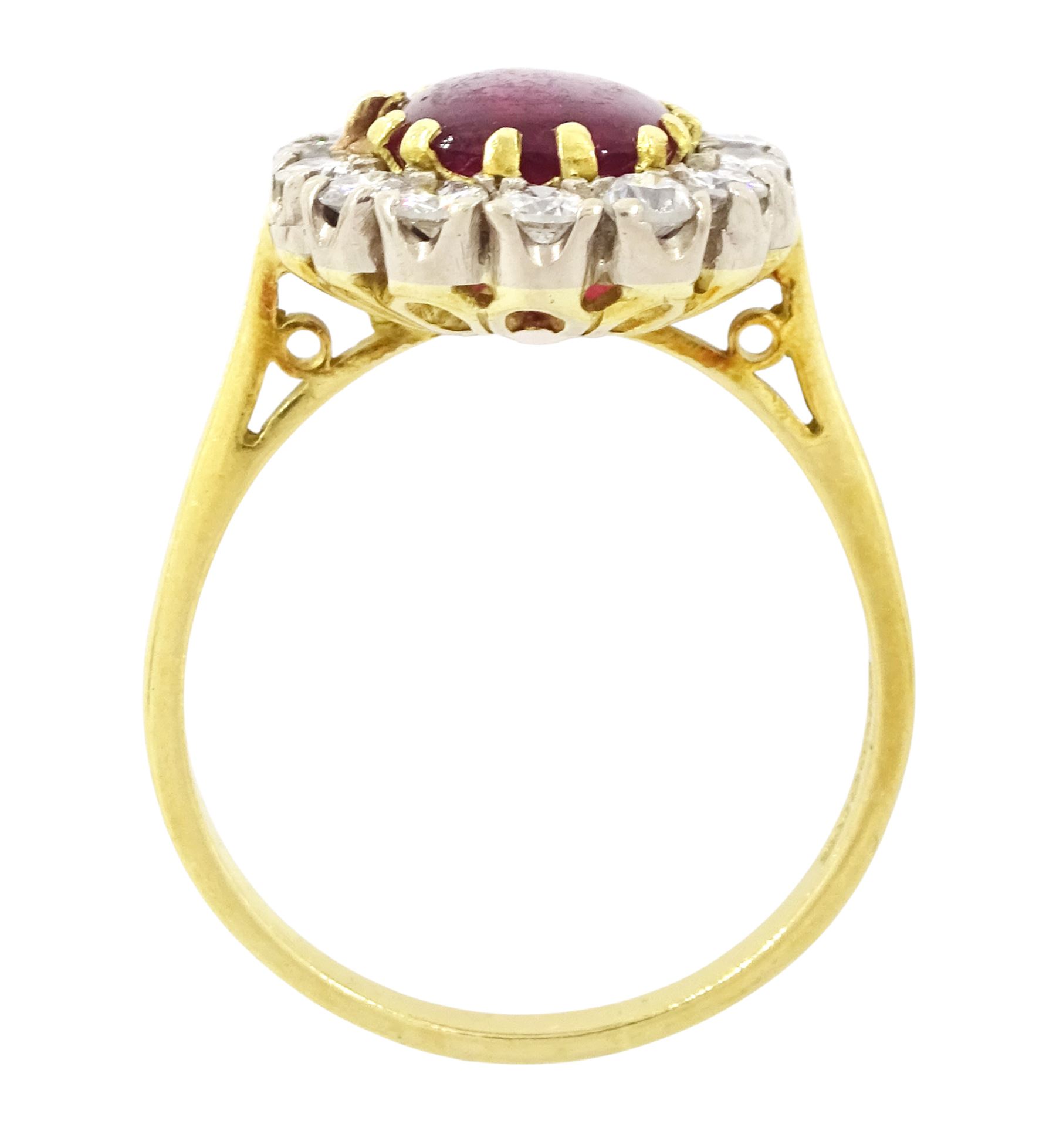 18ct gold garnet and diamond cluster ring, single cabochon cut garnet surrounded by twelve brilliant cut diamonds, London 1970, total diamond weight approx 0.60 carat 