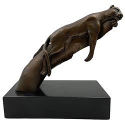 Bronze modelled as a cougar on a branch 