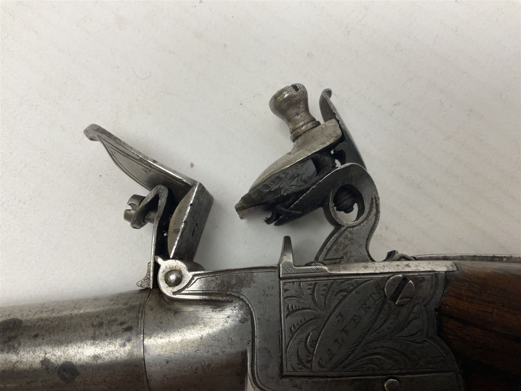 Early 19th century J. Calvert (Leeds) flintlock single barrel tap action pocket pistol, approximately .45 cal., the 4cm (originally) screw off barrel with top safety and walnut stock L16cm overall